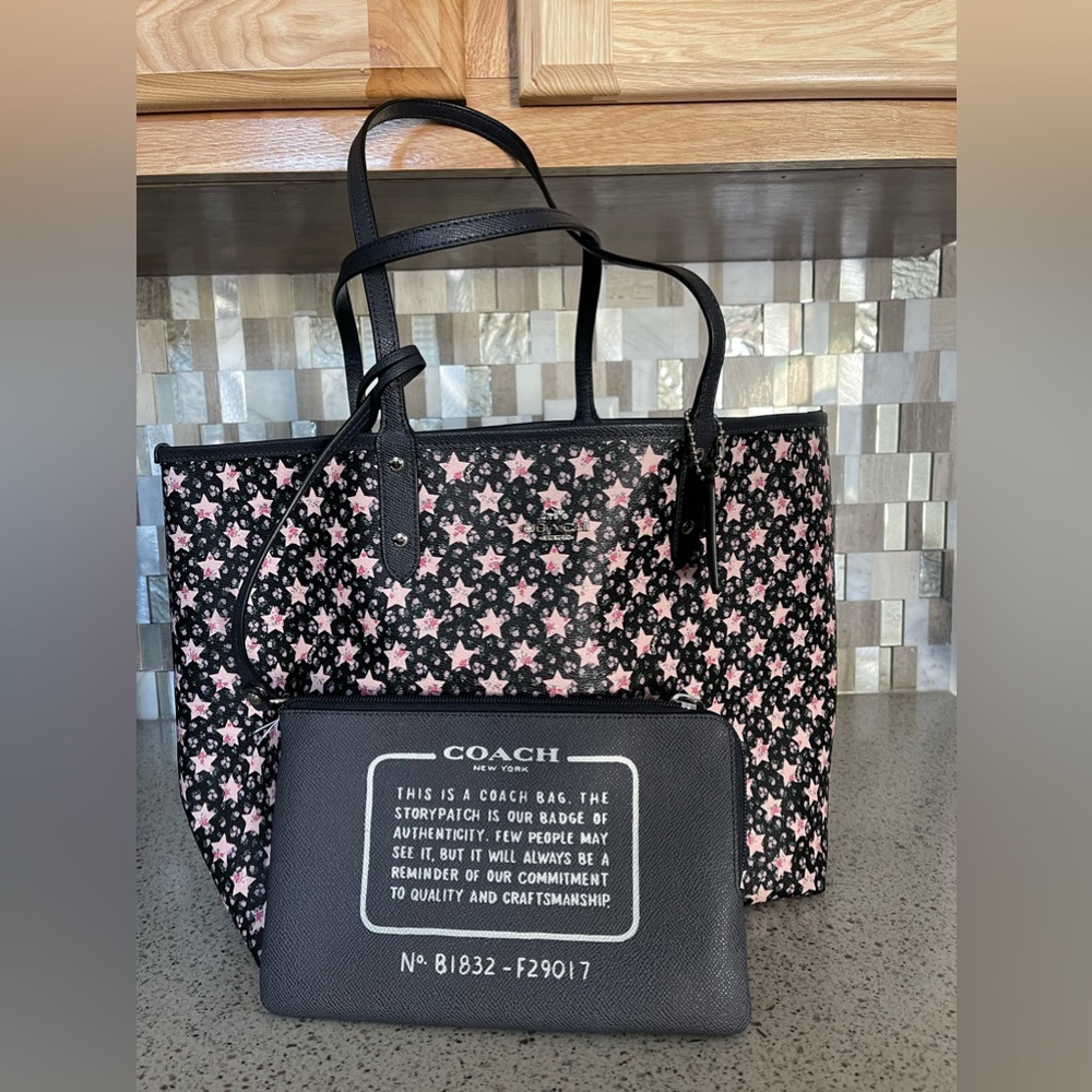 Coach New with tag reversible City Tote.  Midnight blue, Pink Stars.